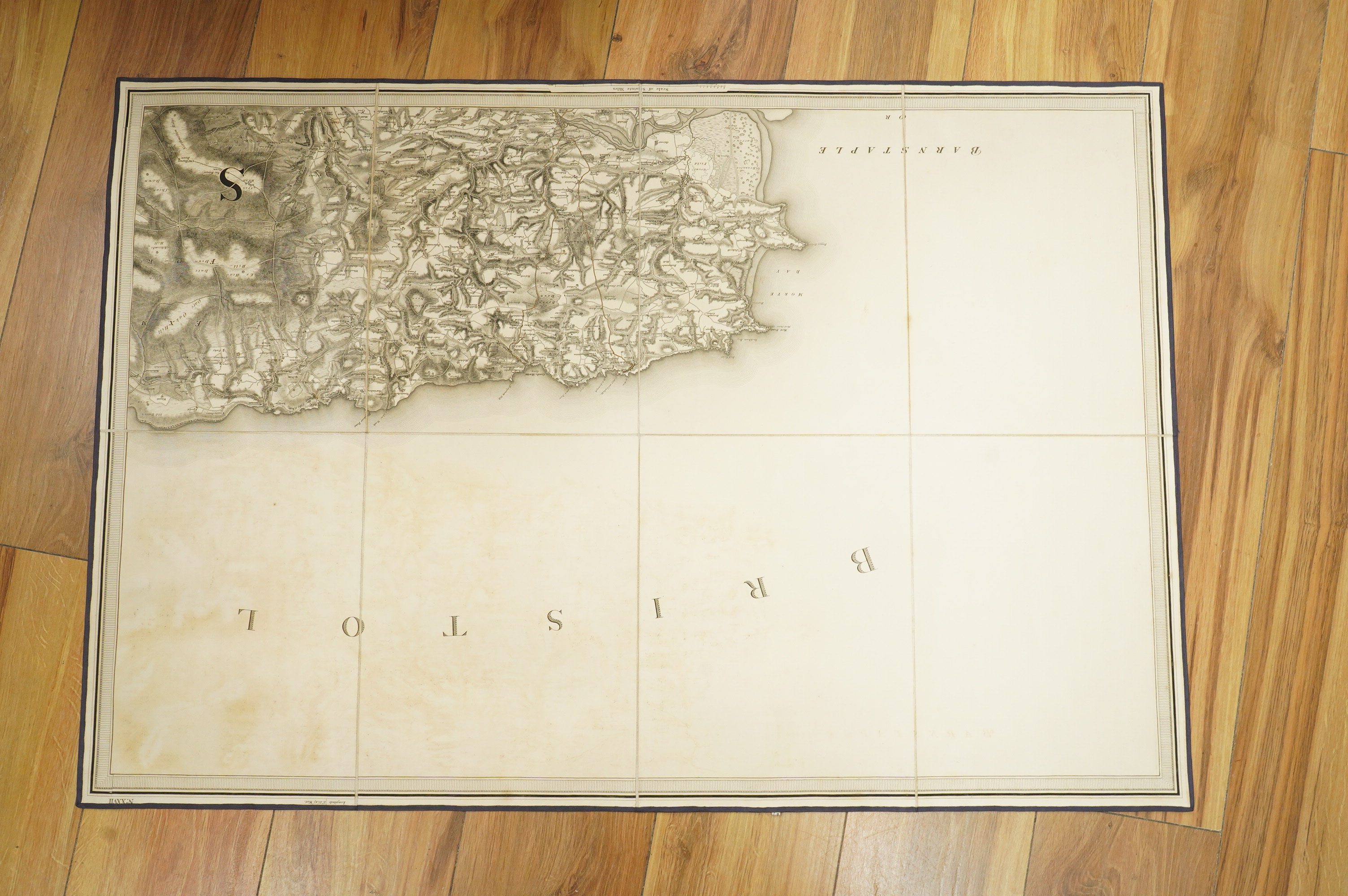 Ordnance Survey maps of Devon, including part of Somerset and Cornwall, comprising of a set of eight engraved maps mounted on linen and edged with blue cotton, including sheet no.s; 20, 21, 22, 23, 24, 25, 26, and 27, pu